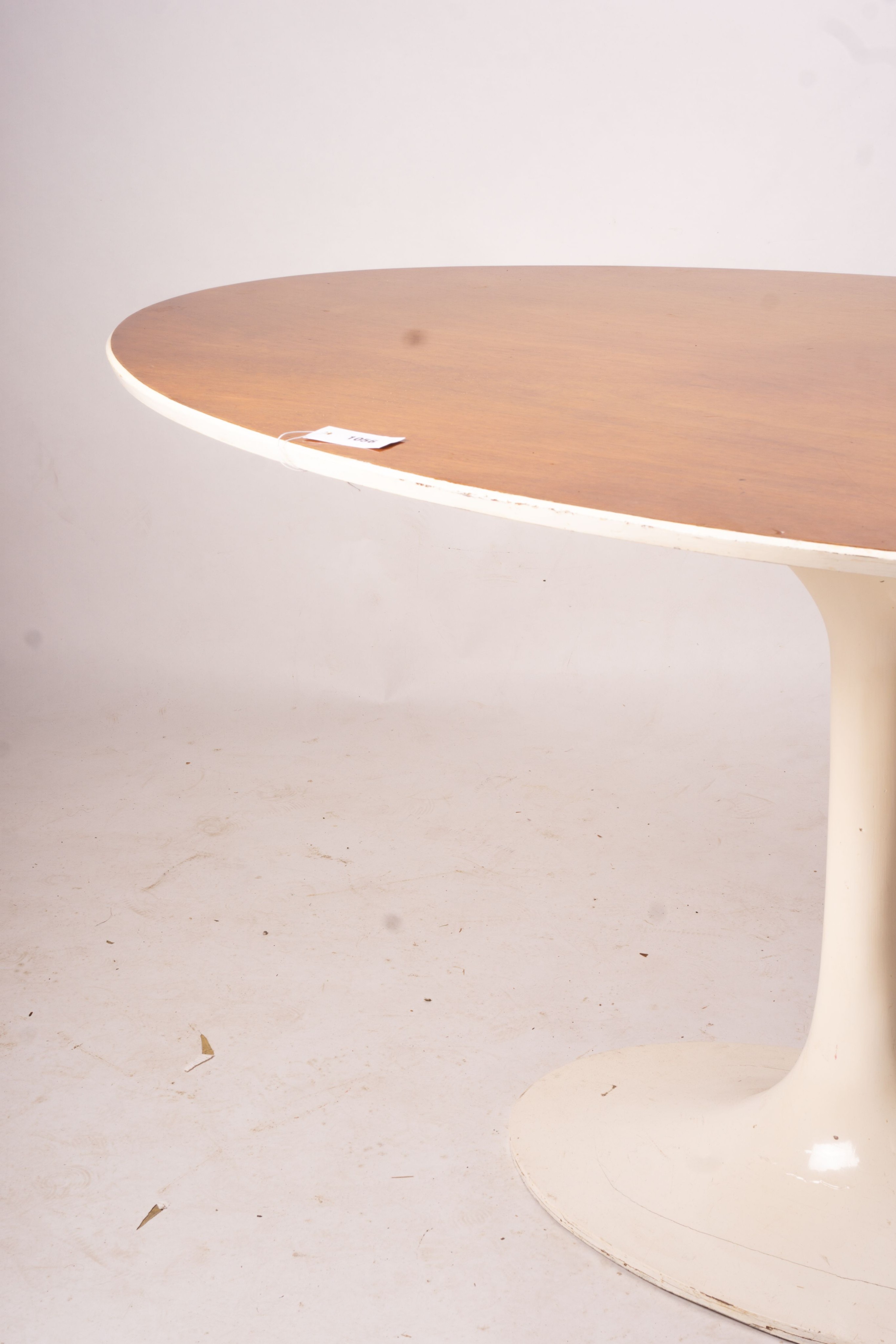 An Arkana style tulip base teak top oval dining table, length 152cm, depth 91cm, height 76cm